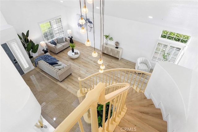 14121 Exeter Ct, Fontana, CA 92336 - living area with radiator, plenty of natural light, wood finished floors, recessed lighting, and baseboards