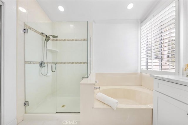 14121 Exeter Ct, Fontana, CA 92336 - bathroom featuring a shower stall, a bath, vanity, and recessed lighting