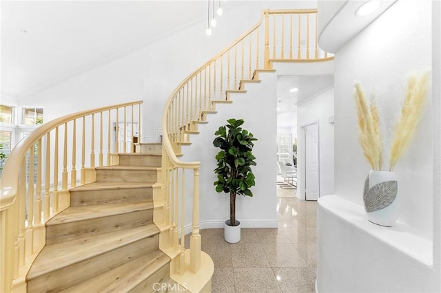 14121 Exeter Ct, Fontana, CA 92336 - stairs with healthy amount of natural light, high vaulted ceiling, baseboards, and granite floors