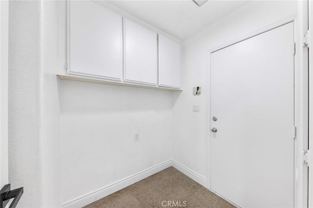 14121 Exeter Ct, Fontana, CA 92336 - laundry room with baseboards and carpet