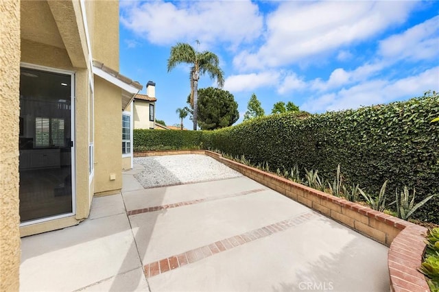 14121 Exeter Ct, Fontana, CA 92336 - fenced backyard featuring a patio area