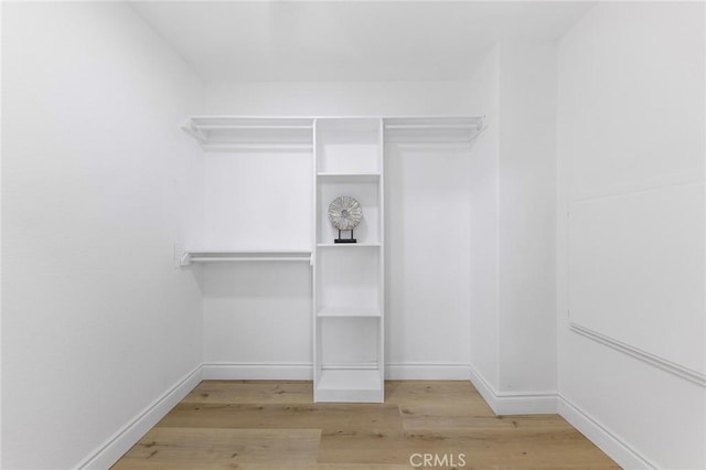 14121 Exeter Ct, Fontana, CA 92336 - spacious closet featuring wood finished floors
