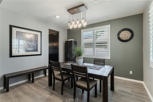 29042 Botanical Cir, Menifee, CA 92584 - dining space with a chandelier, light wood-style floors, baseboards, and recessed lighting