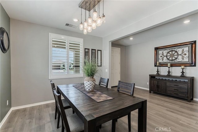 29042 Botanical Cir, Menifee, CA 92584 - dining room with light wood-style floors, baseboards, recessed lighting, and a chandelier
