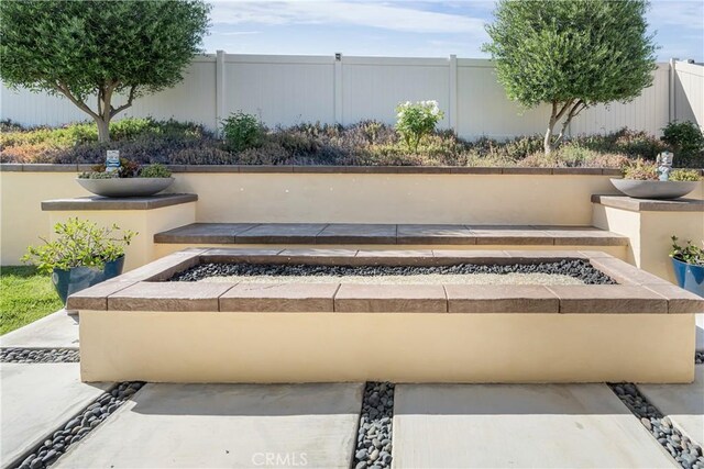 29042 Botanical Cir, Menifee, CA 92584 - view of patio with an outdoor fire pit