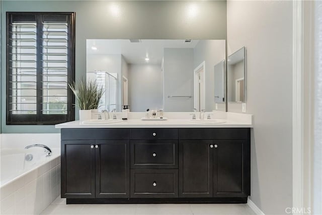 29042 Botanical Cir, Menifee, CA 92584 - bathroom with double vanity, a bath, and tile patterned floors