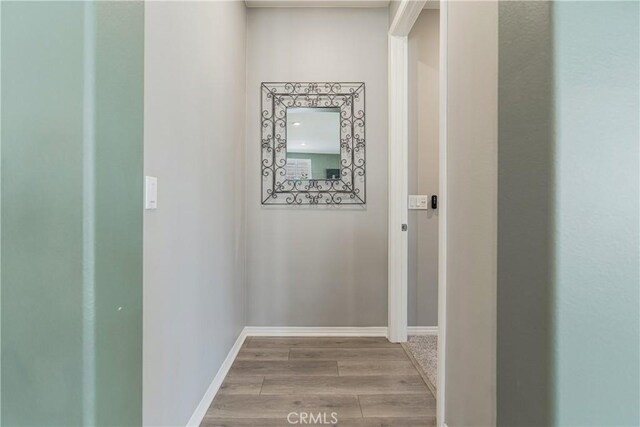 29042 Botanical Cir, Menifee, CA 92584 - hallway with light wood-style flooring and baseboards