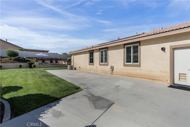 29042 Botanical Cir, Menifee, CA 92584 - back of property with stucco siding, a tiled roof, a lawn, and a patio area