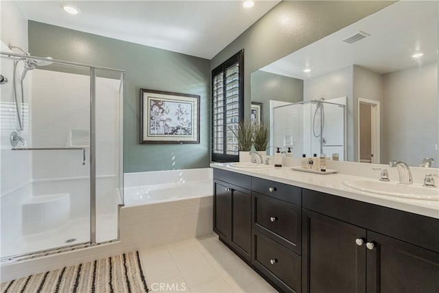 29042 Botanical Cir, Menifee, CA 92584 - bathroom featuring a shower stall, a garden tub, double vanity, tile patterned flooring, and recessed lighting