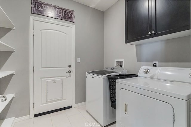 29042 Botanical Cir, Menifee, CA 92584 - laundry area featuring washer and dryer, baseboards, light tile patterned flooring, and cabinet space