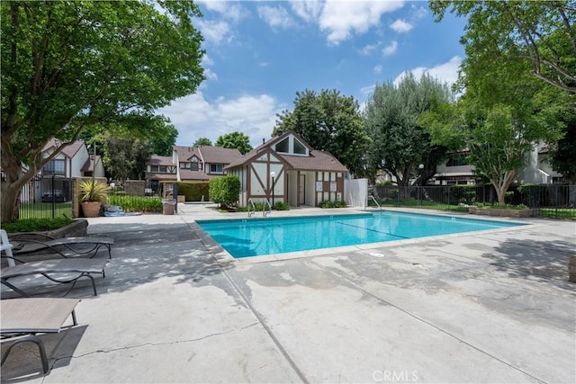 12951 Benson Ave Unit 138, Chino, CA 91710 - community pool featuring a patio area and an outdoor structure