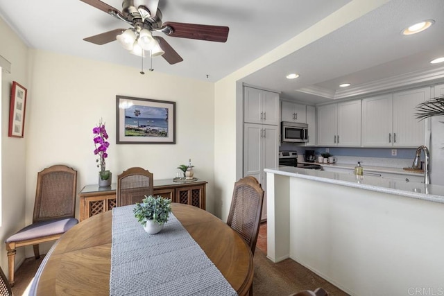 7780 Parkway Dr Unit 703, La Mesa, CA 91942 - carpeted dining room with recessed lighting, a ceiling fan, a sink, and a raised ceiling