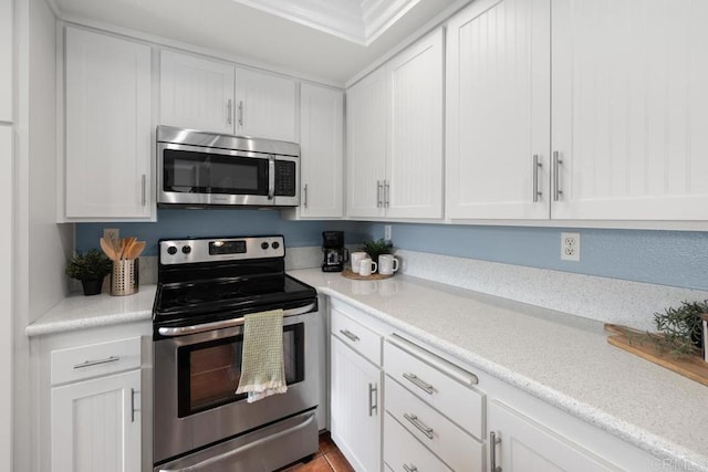 7780 Parkway Dr Unit 703, La Mesa, CA 91942 - kitchen with appliances with stainless steel finishes, white cabinetry, and light countertops