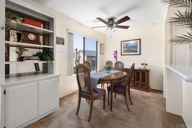 7780 Parkway Dr Unit 703, La Mesa, CA 91942 - dining space featuring light carpet, ceiling fan, and baseboards