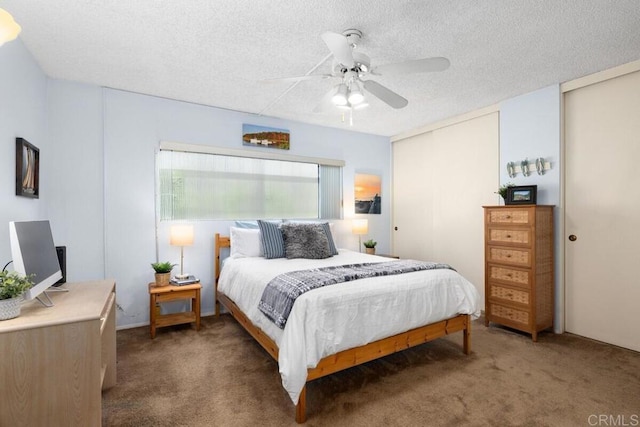 7780 Parkway Dr Unit 703, La Mesa, CA 91942 - bedroom featuring carpet floors, a ceiling fan, a textured ceiling, and multiple closets