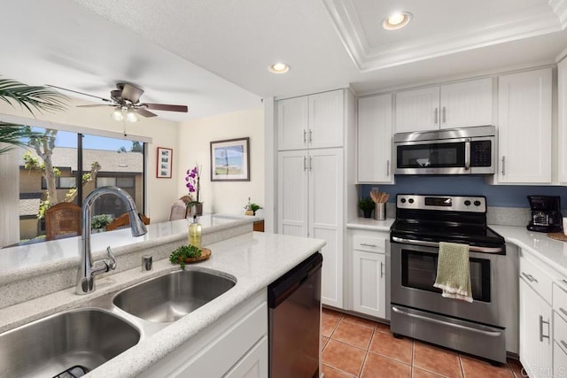 7780 Parkway Dr Unit 703, La Mesa, CA 91942 - kitchen with appliances with stainless steel finishes, a sink, recessed lighting, light tile patterned flooring, and white cabinetry