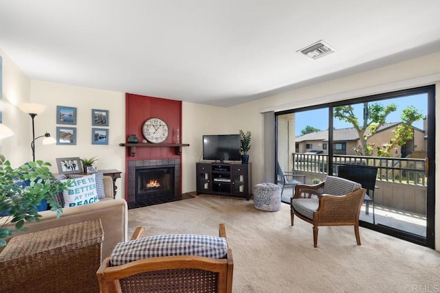7780 Parkway Dr Unit 703, La Mesa, CA 91942 - carpeted living room with a tile fireplace