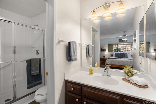7780 Parkway Dr Unit 703, La Mesa, CA 91942 - full bathroom with ensuite bathroom, vanity, a shower stall, and ceiling fan
