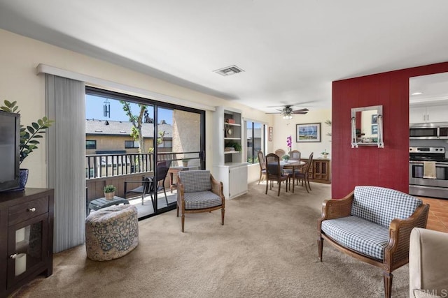 7780 Parkway Dr Unit 703, La Mesa, CA 91942 - sitting room featuring ceiling fan and light carpet