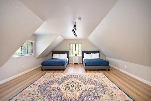25570 Fuerte Rd, Temecula, CA 92590 - bedroom featuring wood finished floors, lofted ceiling, and baseboards