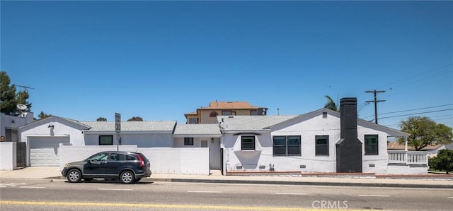 453 N Walker Ave, San Pedro, CA 90732 - ranch-style home featuring an attached garage, stucco siding, a chimney, and concrete driveway