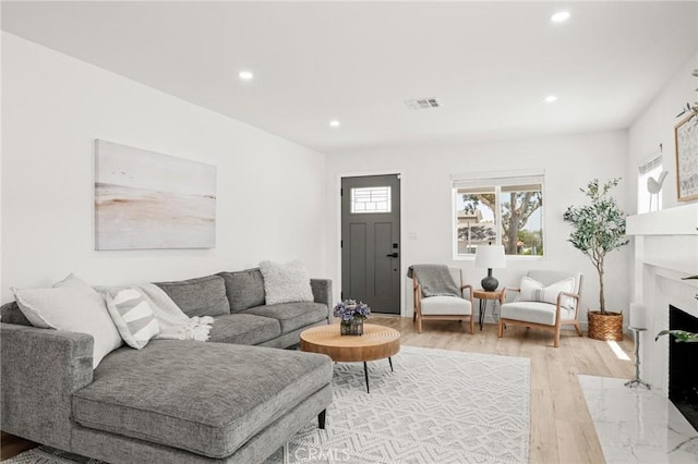 453 N Walker Ave, San Pedro, CA 90732 - living room with light wood-type flooring, recessed lighting, and a premium fireplace