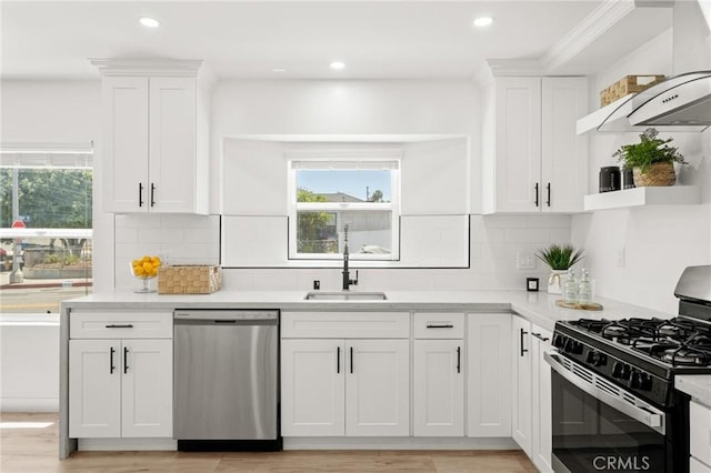 453 N Walker Ave, San Pedro, CA 90732 - kitchen with stainless steel dishwasher, range with gas stovetop, open shelves, a sink, and white cabinetry