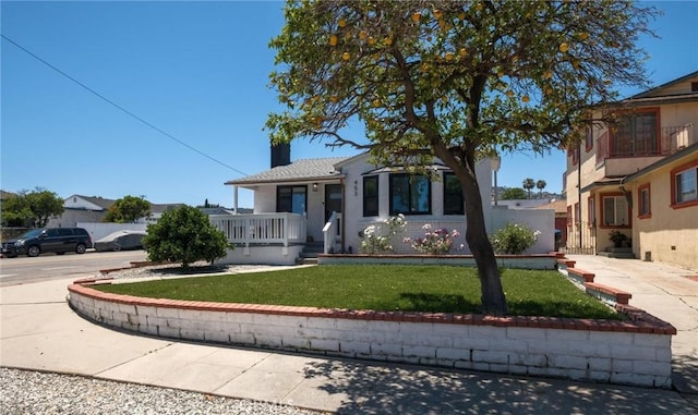 453 N Walker Ave, San Pedro, CA 90732 - view of front of property with a front lawn, covered porch, and a chimney