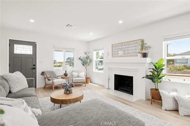453 N Walker Ave, San Pedro, CA 90732 - living room featuring healthy amount of natural light, light wood-type flooring, a fireplace with flush hearth, and recessed lighting