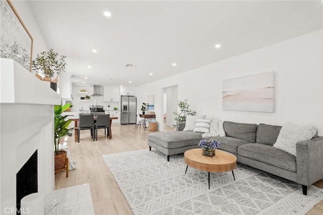 453 N Walker Ave, San Pedro, CA 90732 - living area featuring light wood-style flooring and recessed lighting