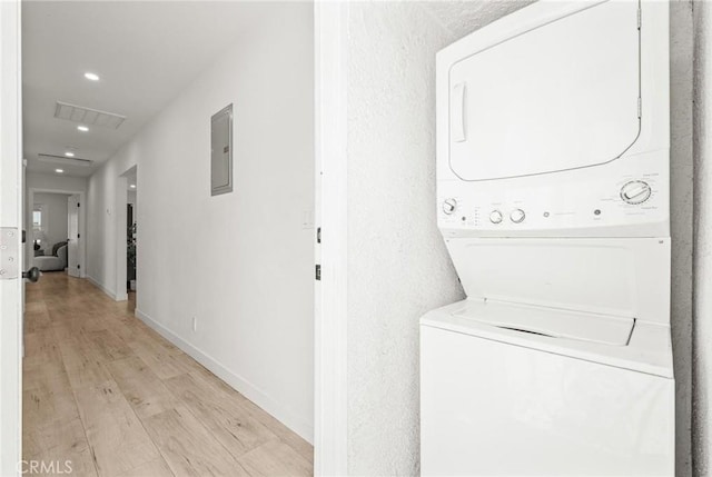 453 N Walker Ave, San Pedro, CA 90732 - laundry area with stacked washer and clothes dryer, light wood-type flooring, recessed lighting, electric panel, and baseboards