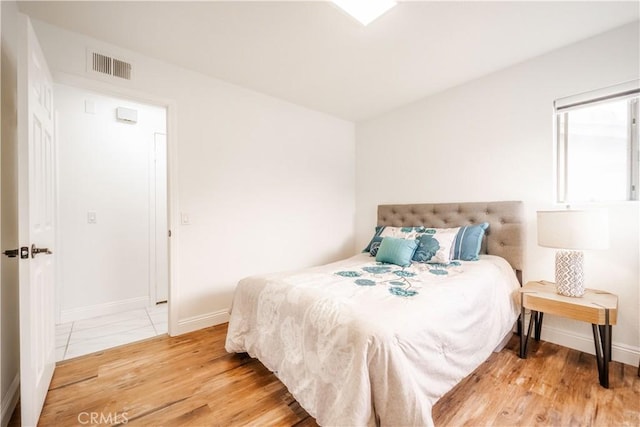 46 Echo Run Unit 16, Irvine, CA 92614 - bedroom featuring light wood-type flooring and baseboards