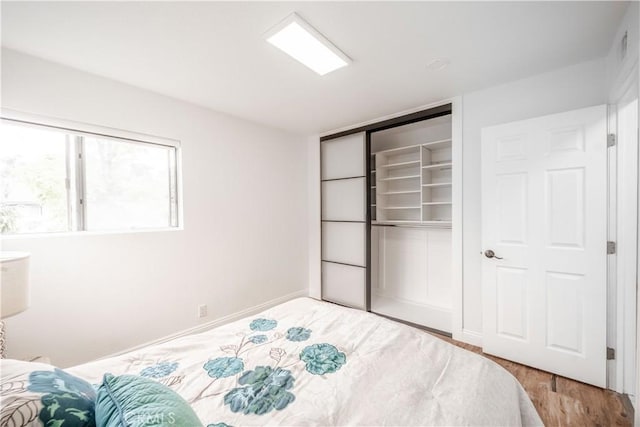 46 Echo Run Unit 16, Irvine, CA 92614 - bedroom featuring wood finished floors and a closet