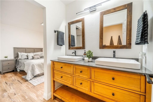 46 Echo Run Unit 16, Irvine, CA 92614 - full bath featuring double vanity and wood finished floors