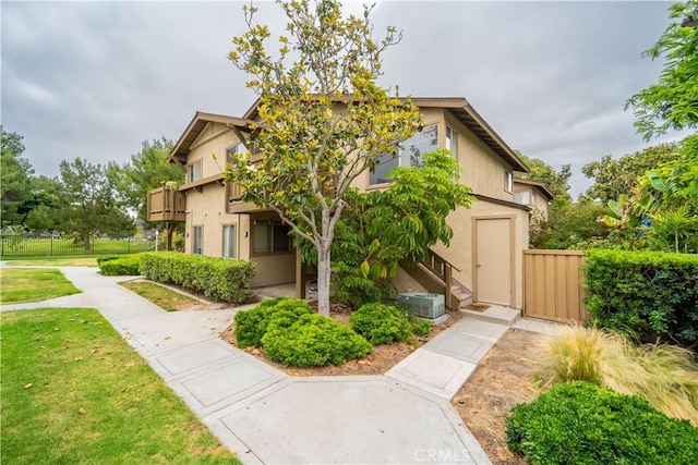 46 Echo Run Unit 16, Irvine, CA 92614 - view of property exterior featuring stucco siding and a balcony