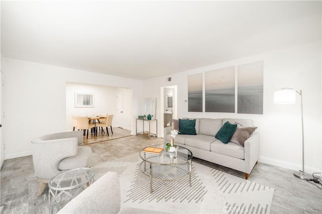 46 Echo Run Unit 16, Irvine, CA 92614 - living room featuring light wood-style flooring and baseboards