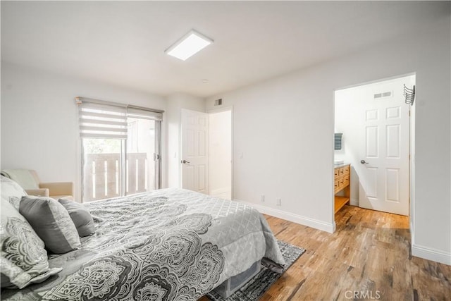 46 Echo Run Unit 16, Irvine, CA 92614 - bedroom with light wood finished floors and baseboards