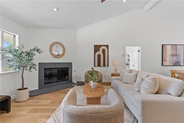 2011 Reynosa Dr, Torrance, CA 90501 - living room with wood finished floors, a brick fireplace, recessed lighting, and baseboards