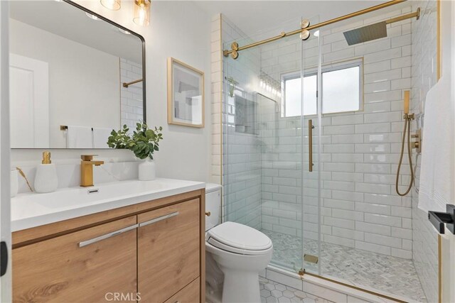 2011 Reynosa Dr, Torrance, CA 90501 - bathroom with vanity, toilet, a shower stall, and tile patterned floors