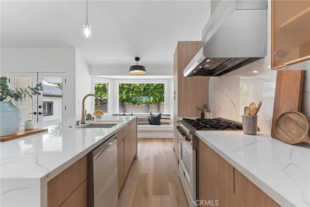 2011 Reynosa Dr, Torrance, CA 90501 - kitchen featuring stainless steel dishwasher, modern cabinets, wall chimney exhaust hood, a sink, and light wood-type flooring