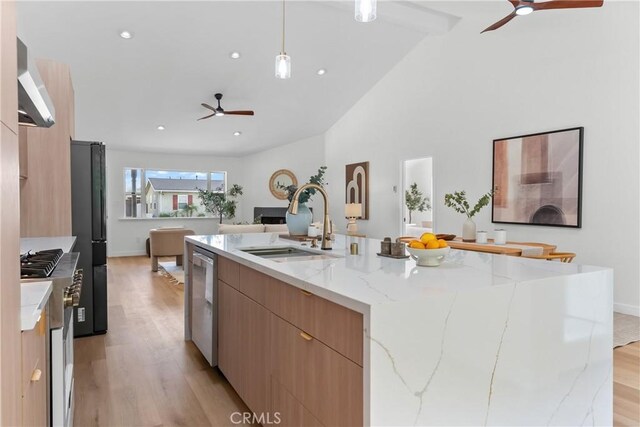 2011 Reynosa Dr, Torrance, CA 90501 - kitchen with ceiling fan, modern cabinets, a sink, wall chimney exhaust hood, and light wood finished floors