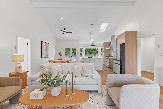 2011 Reynosa Dr, Torrance, CA 90501 - living room with high vaulted ceiling, light wood finished floors, french doors, ceiling fan, and a skylight