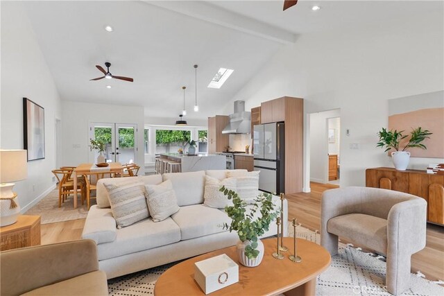 2011 Reynosa Dr, Torrance, CA 90501 - living area featuring light wood-type flooring, high vaulted ceiling, a ceiling fan, beam ceiling, and a skylight
