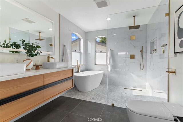 2011 Reynosa Dr, Torrance, CA 90501 - full bath featuring double vanity, a marble finish shower, a freestanding bath, and tile patterned flooring