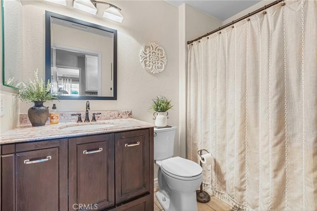 27141 Calle Ayrton, Menifee, CA 92586 - bathroom featuring toilet, vanity, a textured wall, and a shower with curtain