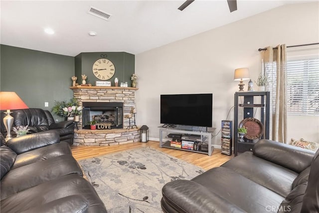 27141 Calle Ayrton, Menifee, CA 92586 - living area featuring wood finished floors, ceiling fan, a stone fireplace, baseboards, and recessed lighting
