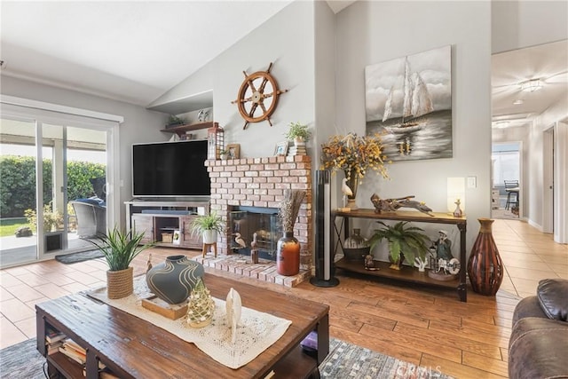 27141 Calle Ayrton, Menifee, CA 92586 - living area with lofted ceiling, a brick fireplace, and wood finished floors