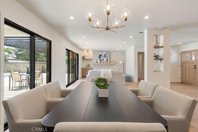 1932 Chapman Rd, Claremont, CA 91711 - dining area featuring healthy amount of natural light, light wood-style flooring, recessed lighting, a chandelier, and baseboards