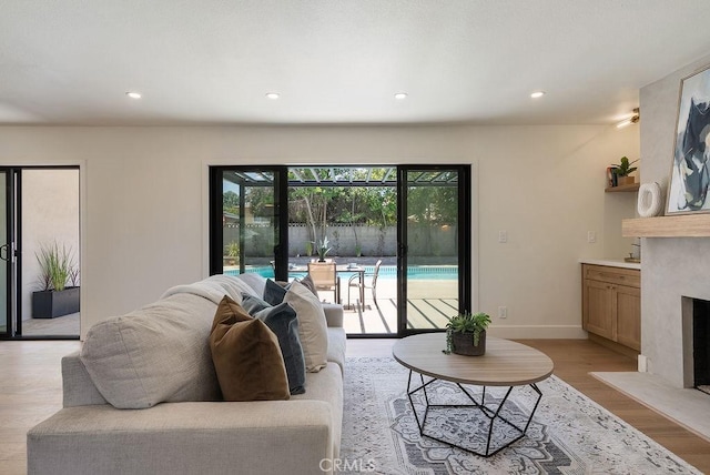 1932 Chapman Rd, Claremont, CA 91711 - living area with a fireplace, light wood-type flooring, recessed lighting, and baseboards