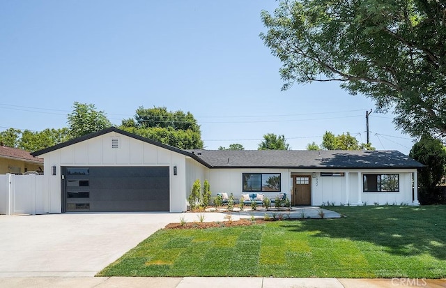 1932 Chapman Rd, Claremont, CA 91711 - view of front facade featuring an attached garage, concrete driveway, and board and batten siding